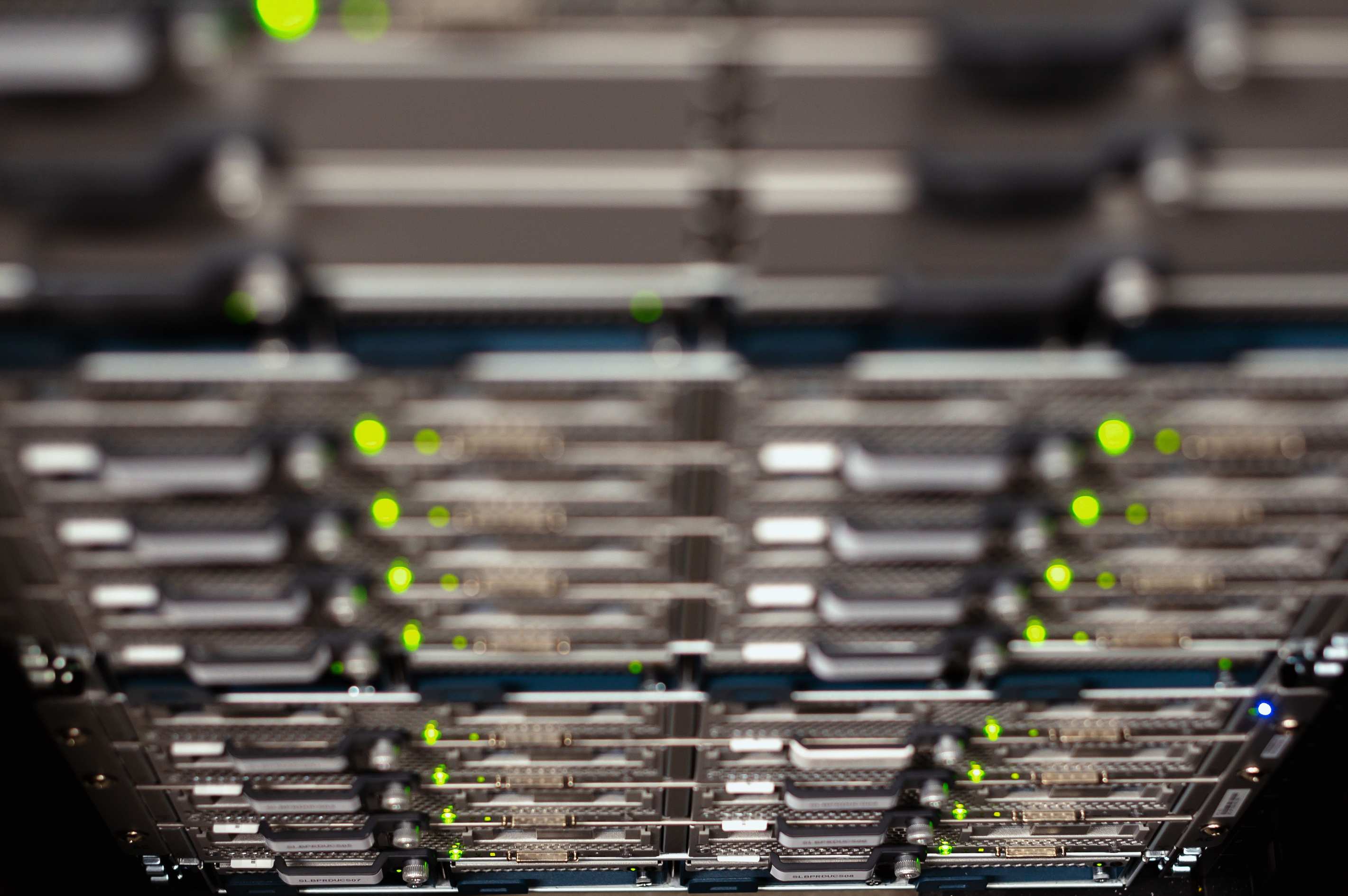 Server racks and cabling in a data centre aisle, contemporary cable trays in a modern data center